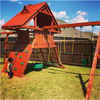 Image of Gorilla Sun Palace Wooden Swing Set in backyard