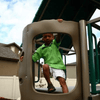 Image of LIFETIME A-Frame Metal Playset boy on top of climbing wall