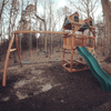 Image of chateau swing set with malibu wood roof in the yard