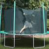 Image of climbing into 13.5' round magic circle trampoline with safety cage